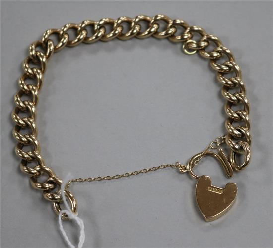 A 9ct gold curb link bracelet with heart shaped clasp, 16.3 grams.